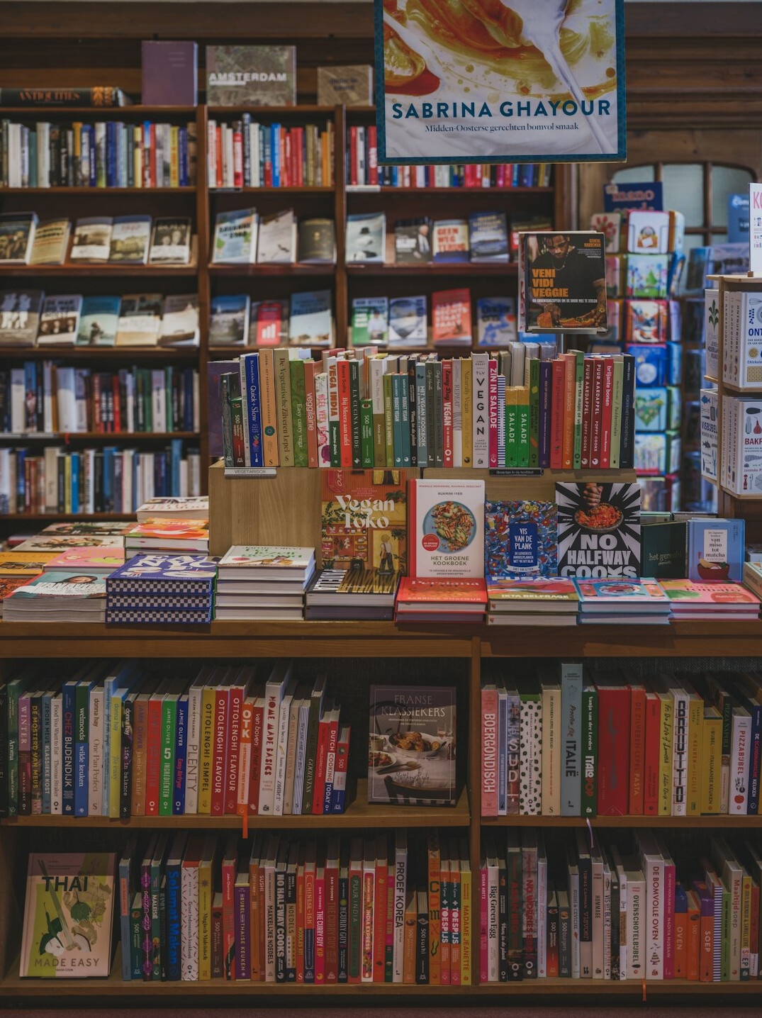 Books arranged on wooden shelves