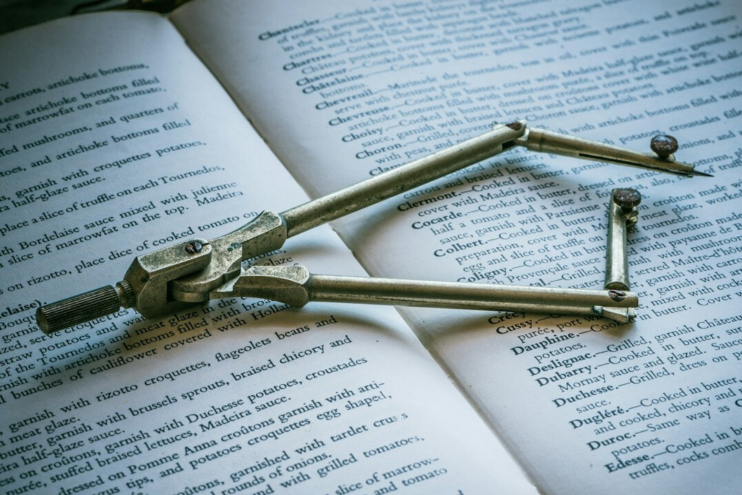 Book with a magnifying glass on a desk