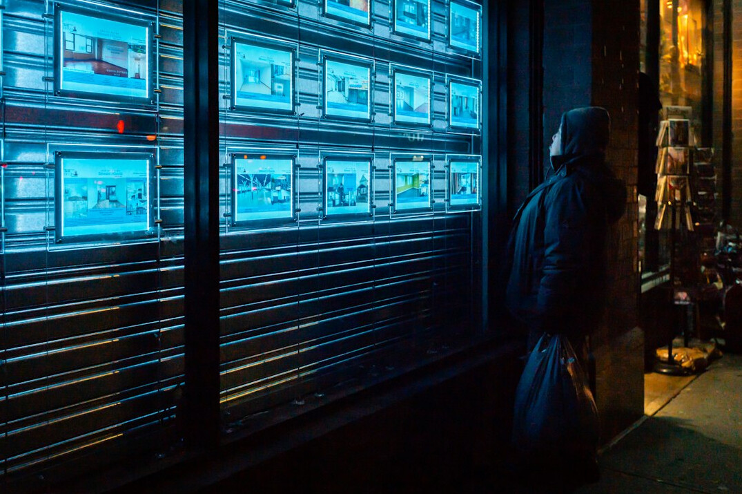 man checking security monitors